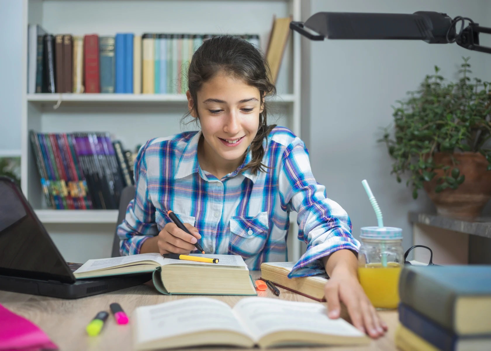 Student studying with books and notes